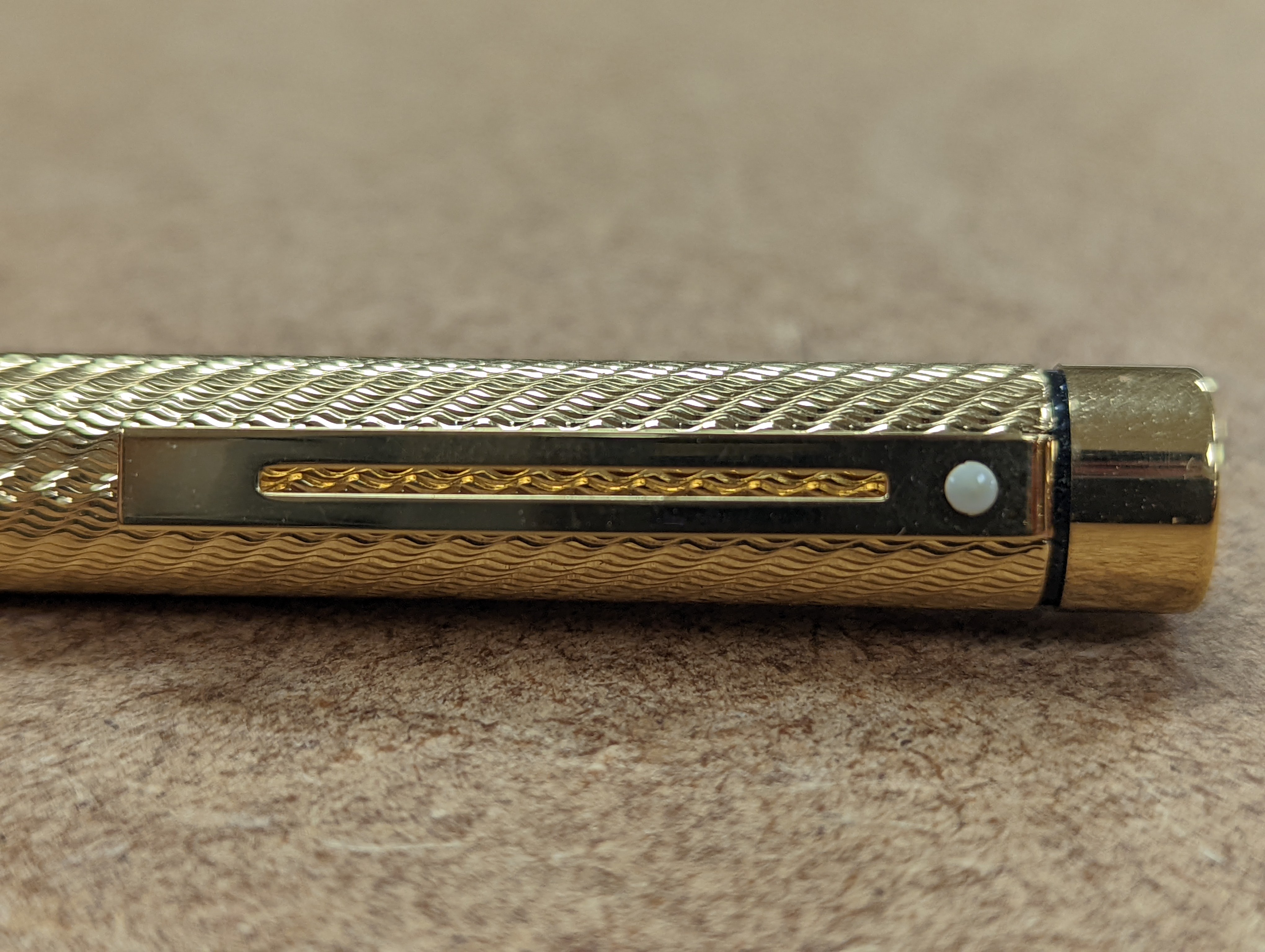 A cased gold plated Shaeffer fountain pen.